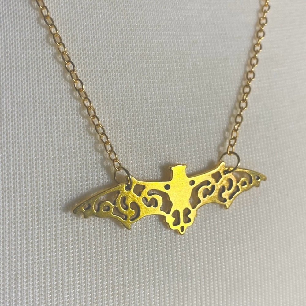 Goldtone bat filigree necklace